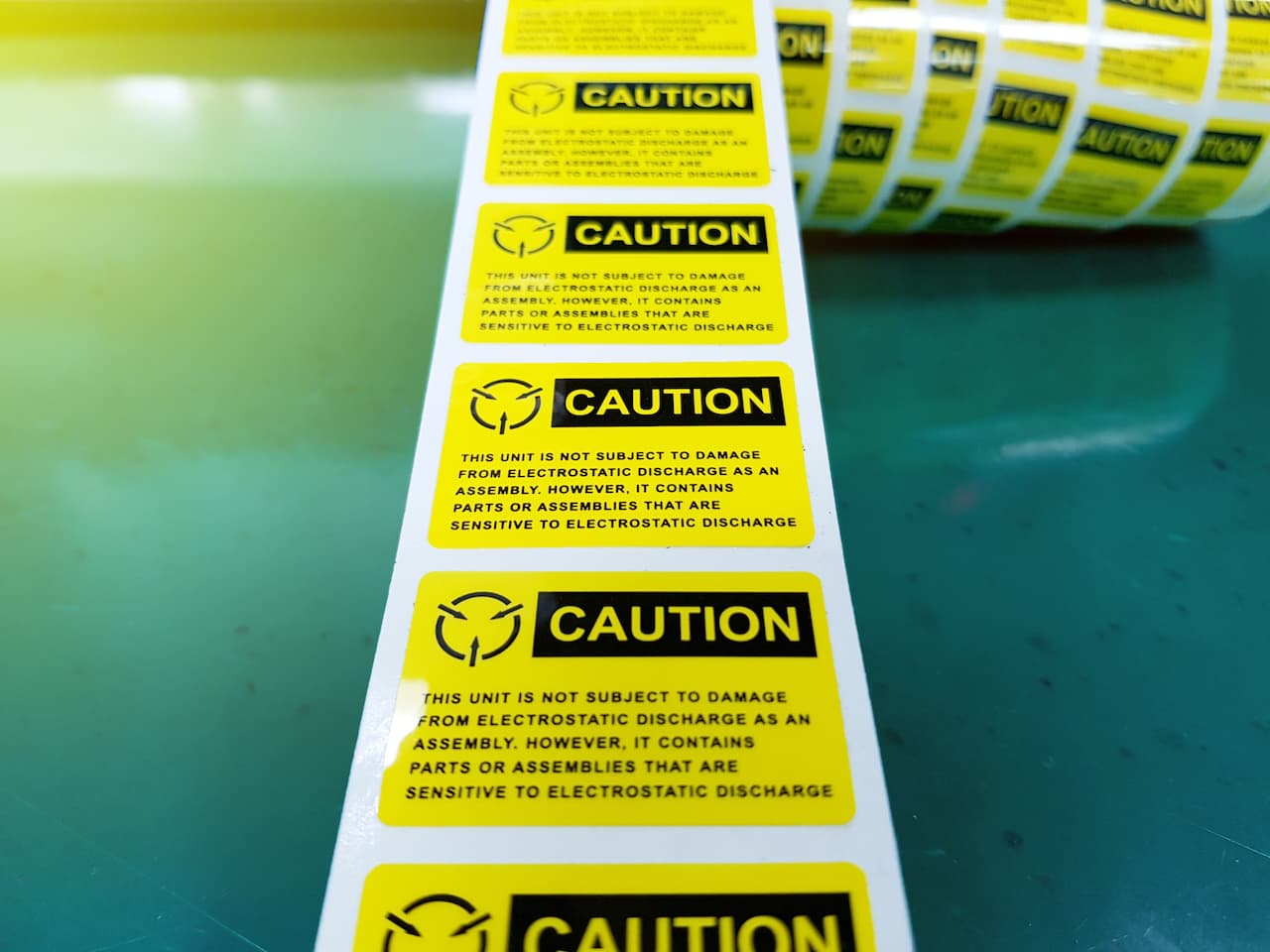 Etiquetas de transferencia térmica PREMCO con textos de precaución